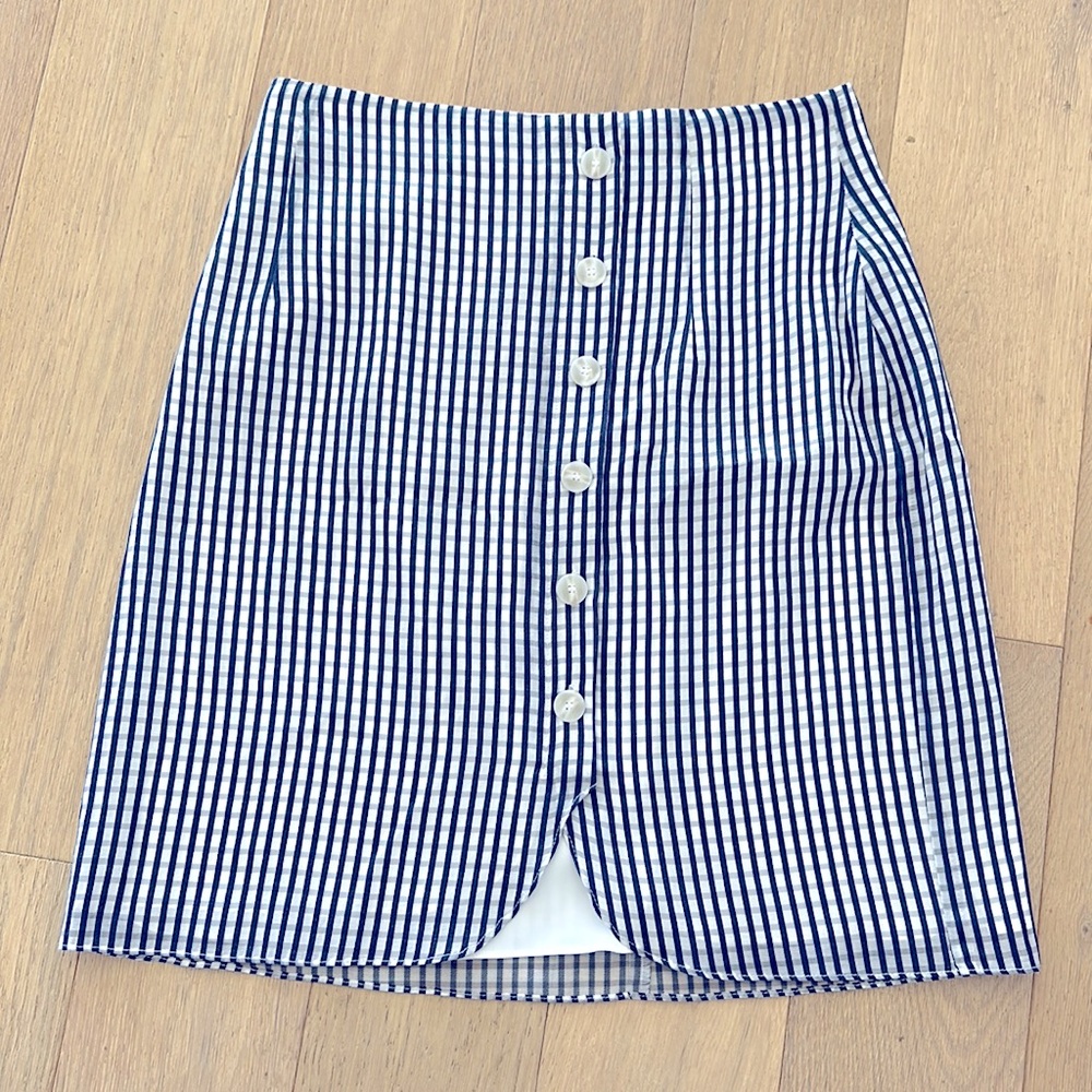 Navy blue plaid mini skirt. Size 4. Never worn.